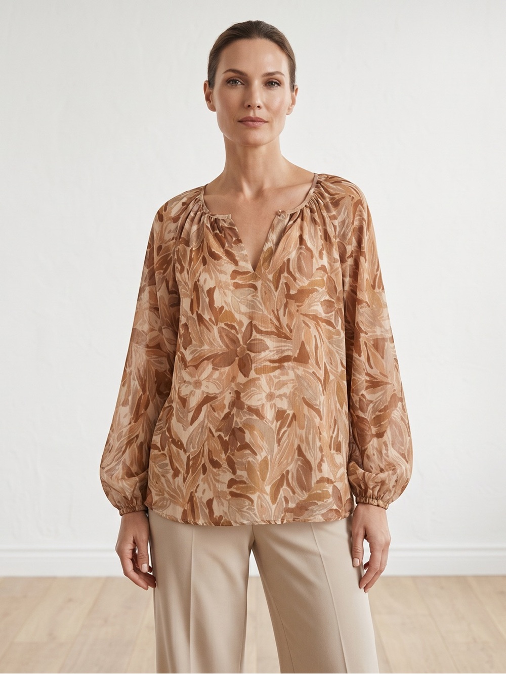 Neutral botanical v-neck print in warm tan, caramel, and soft beige tones.